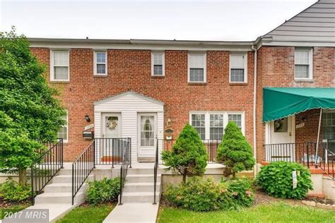 The main level offers a large open dining area with recessed lighting overlooking a spacious living area with brick fireplace. . Redfin townhomes for sale